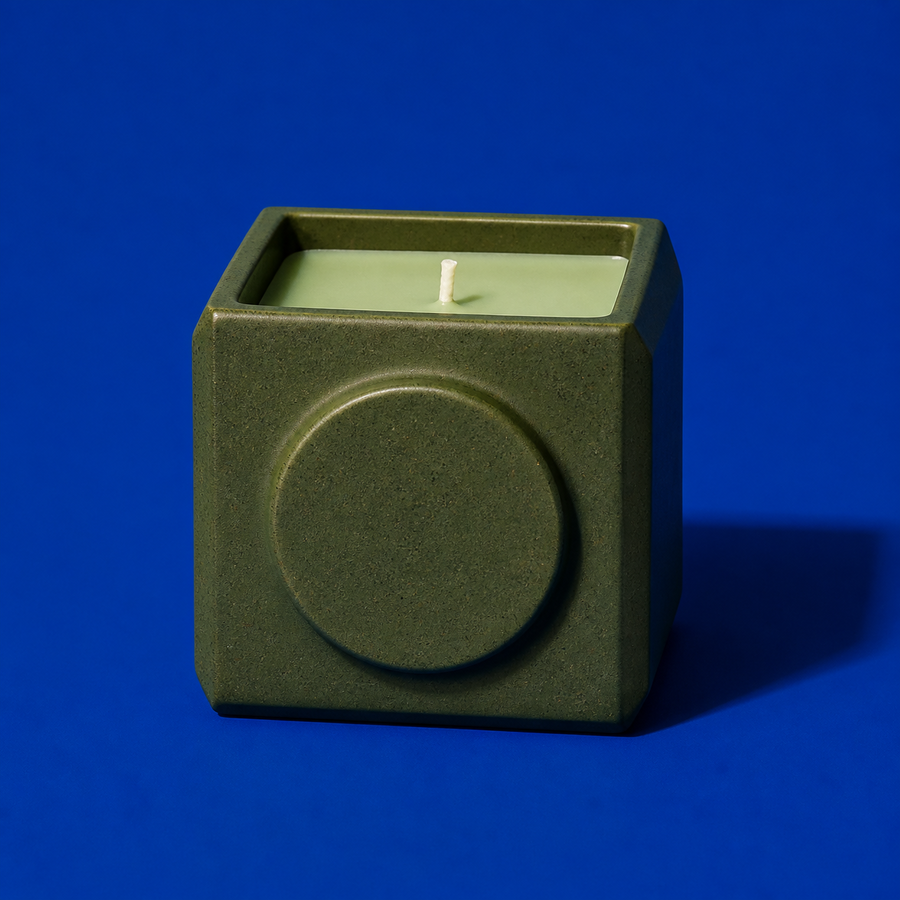 Moss scented candle in a geometric green ceramic vessel with sage wax